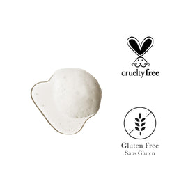 100% PURE shampoo in hand showing bottle size and tactile grip