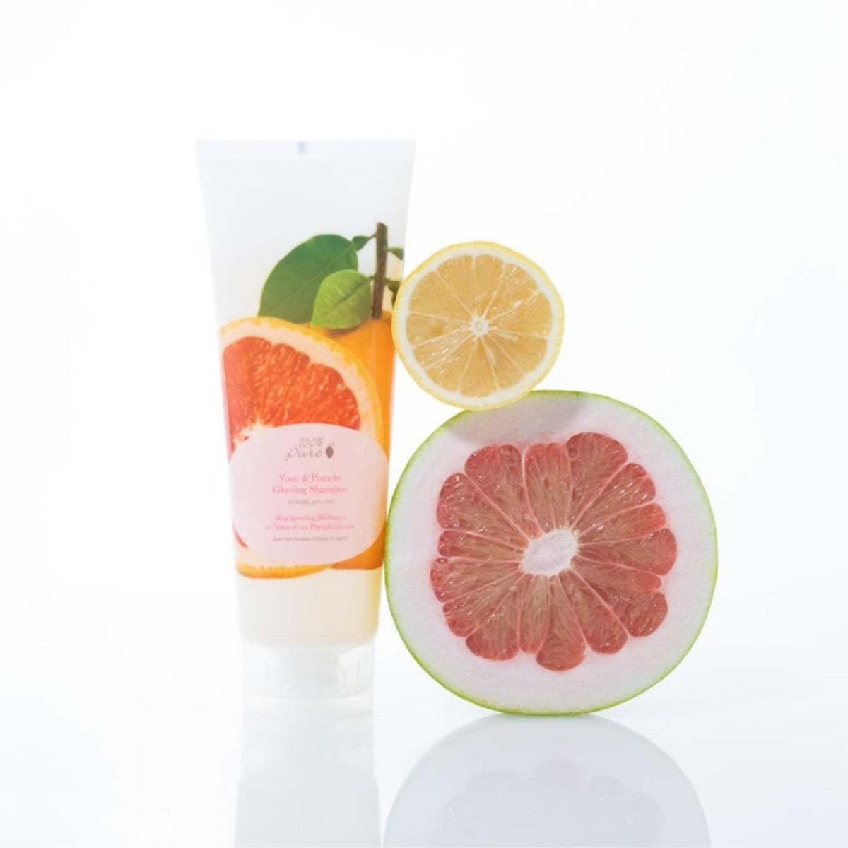 100% PURE ingredients flatlay including yuzu, pomelo, kelp, nettle