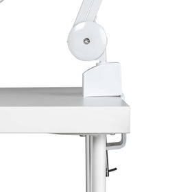 4BLANC flexible pantograph arm positioned over nail station for targeted suction