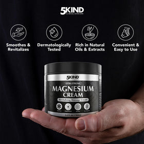 5kind clinical skincare cream on hand being massaged into muscle for quick absorption
