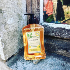 A LA MAISON bottle label noting 50% recycled plastic packaging