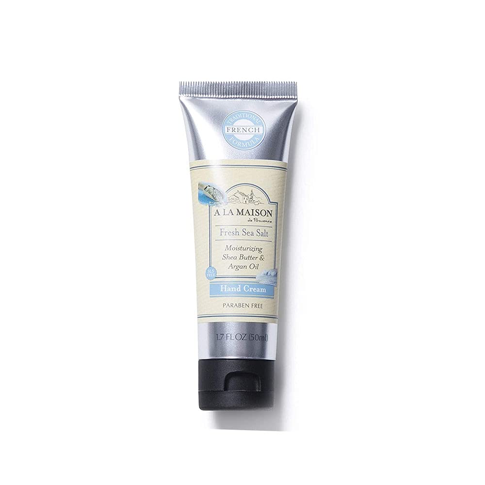A LA MAISON cream being applied to hands demonstrating hydration and non-greasy finish