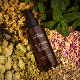 A LA MAISON spray mist applied to forearm for fast absorption and non-greasy finish