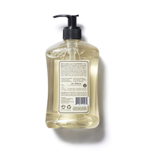 A LA MAISON bottle next to a hand to show scale and easy dispensing convenience