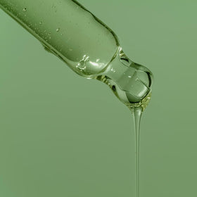 A&A oil being poured onto hand demonstrating smooth glide benefit