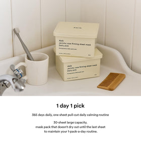 Abib hand holding pack for scale to show compact daily-friendly size