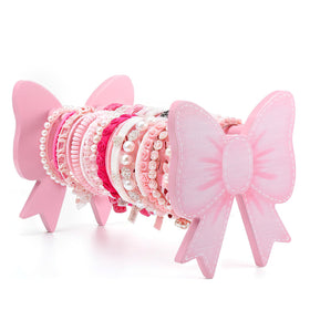 AceOrbit front view pink bow stand showing decorative display and organized storage benefit