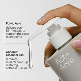 ACT+ ACRE bottle next to hand for scale showing compact travel‑friendly size