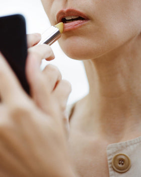 ACTIVIST lip balm applied on model lips demonstrating hydrated, fuller look