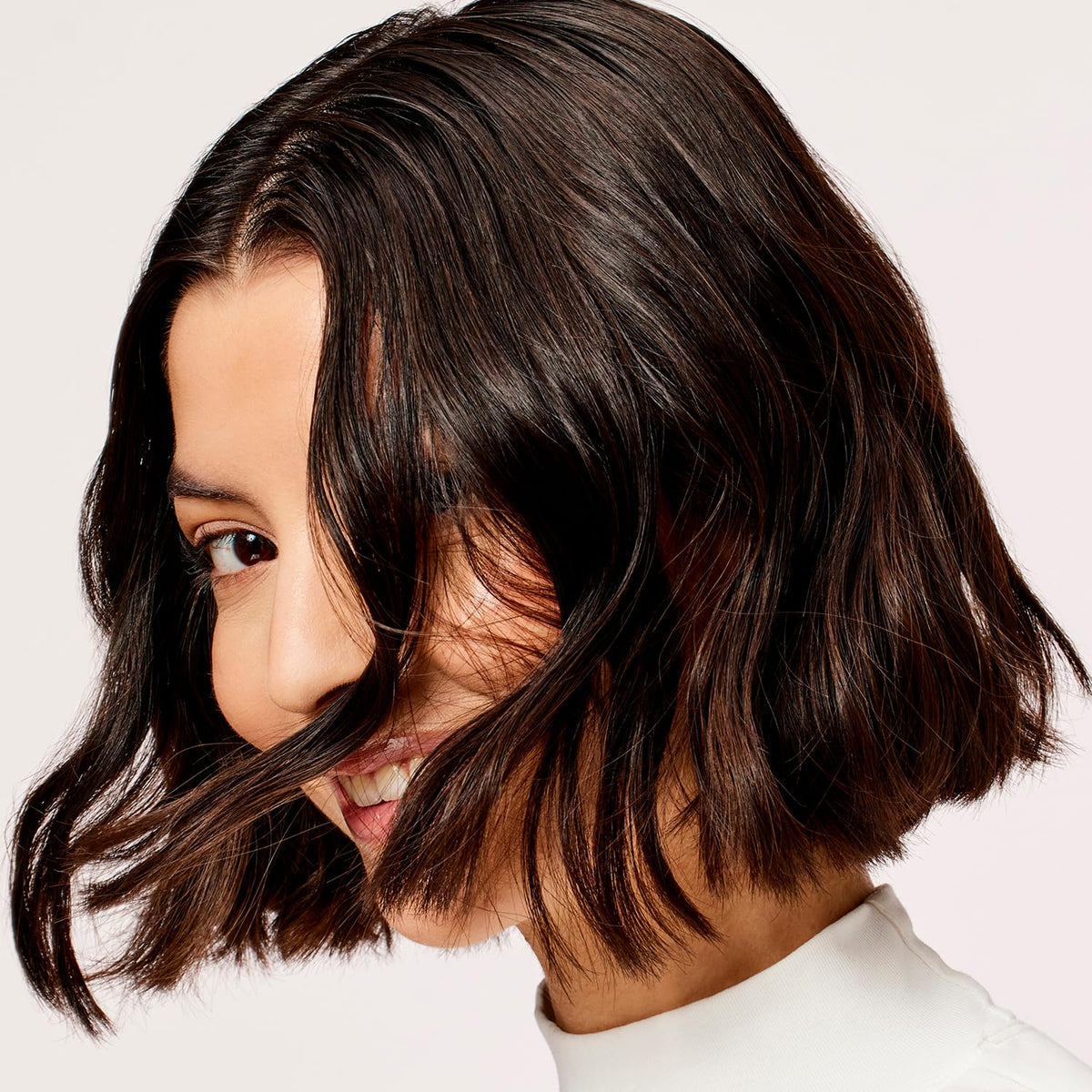 Acure conditioner applied to wet hair demonstrating smooth detangling