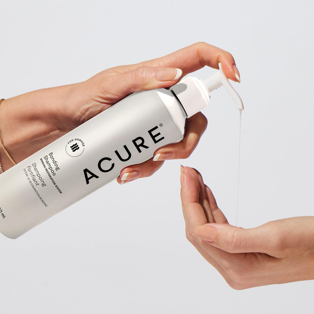 Acure Bonding Shampoo being massaged into wet hair to show usage benefit