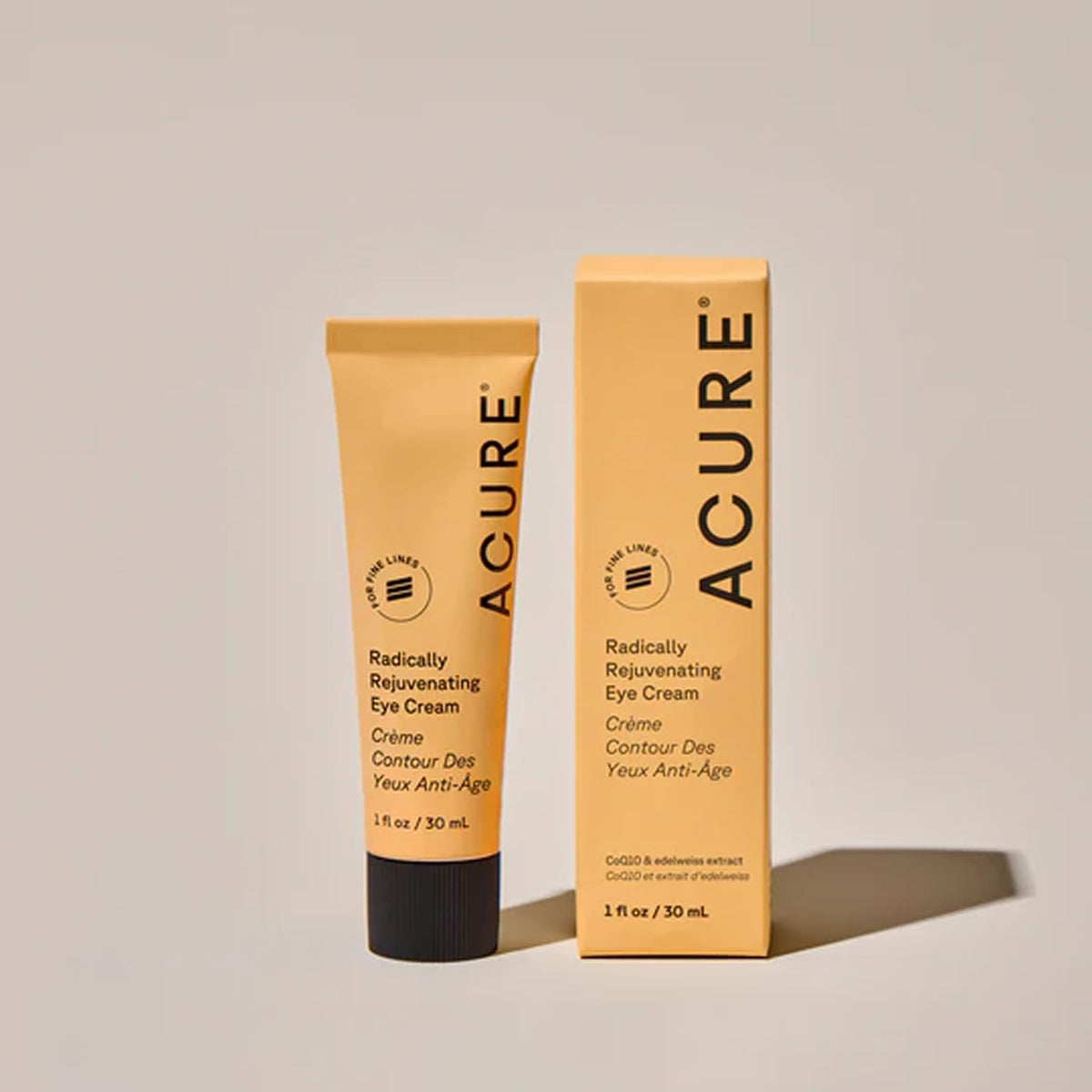 Acure eye cream next to a ruler showing 1 fl oz size for travel convenience