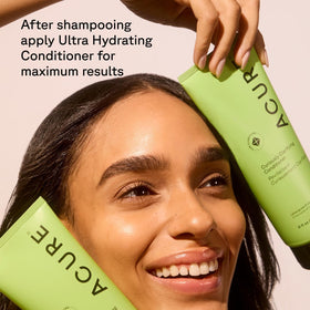 Argan oil and lemongrass near bottle illustrating nourishing ingredients