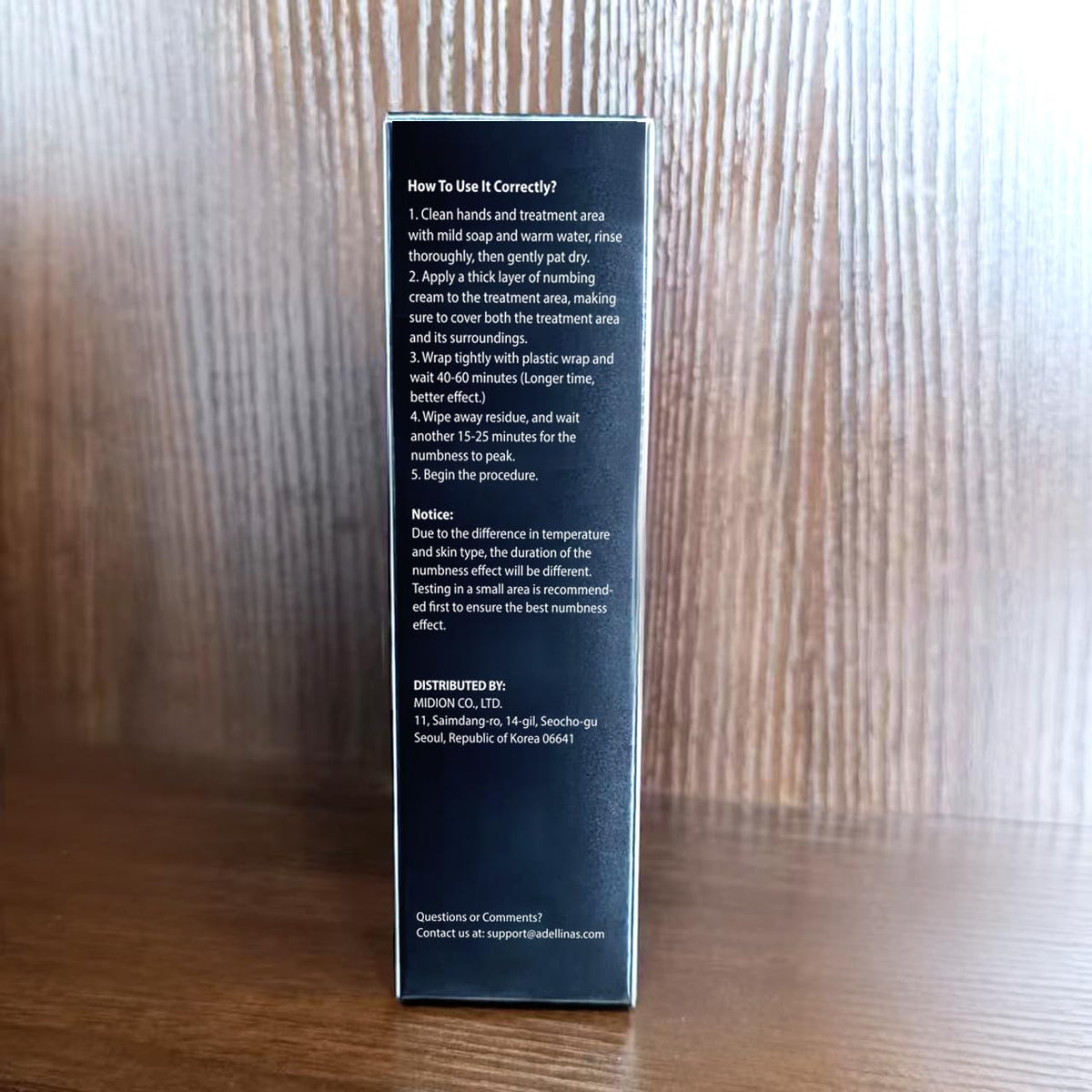 Adellina tube with open cap dispensing cream showing controlled application