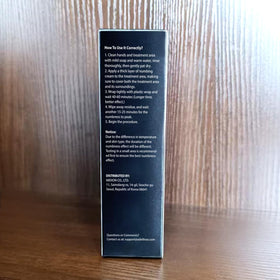 Adellina tube with open cap dispensing cream showing controlled application