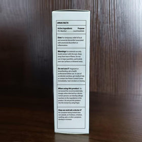 Adellina size comparison next to ruled paper showing 2 fl oz scale