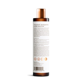 Advanced Trichology product label close-up listing peptides and botanicals for informed choice