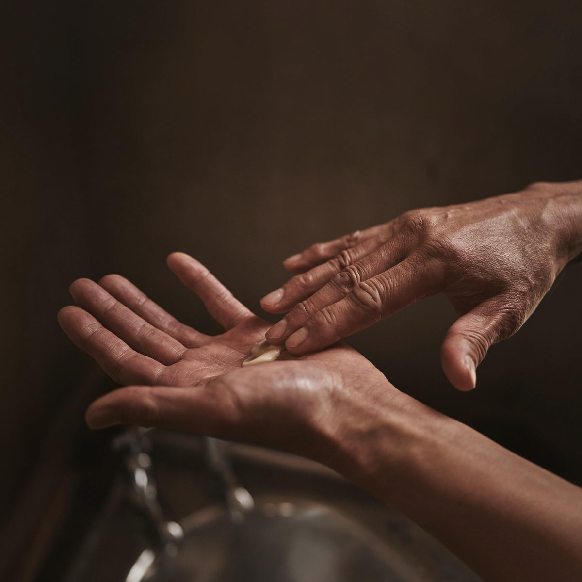 Aesop application on forearm showing fast absorption and immediate softening benefit