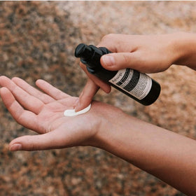 Aesop lotion being applied to forearm showing quick absorption benefit