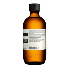 Aesop toner on bathroom shelf in lifestyle scene showing routine-ready benefit