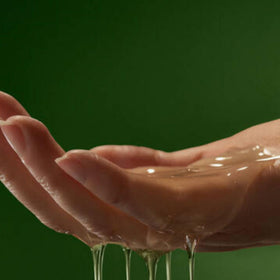 Aesop body cleanser in hand during shower demonstrating gentle lather