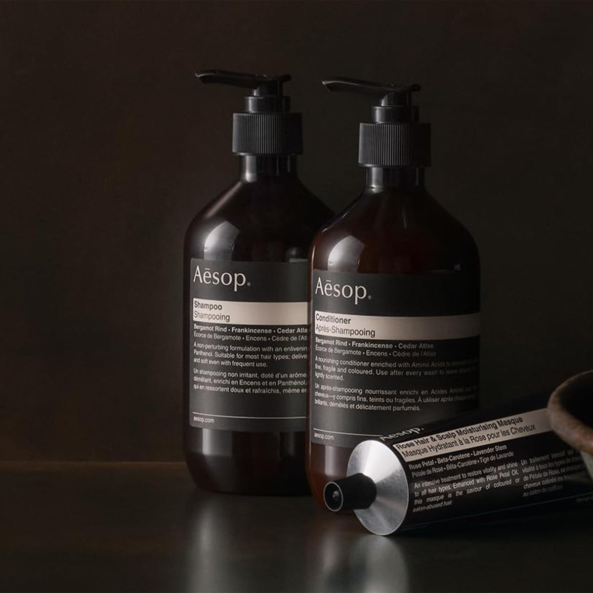 Aesop conditioner being applied to hair demonstrating hydration and softness