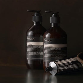 Aesop conditioner being applied to hair demonstrating hydration and softness