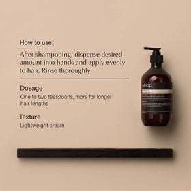 Aesop conditioner texture on palm showing creamy slip for easy detangling
