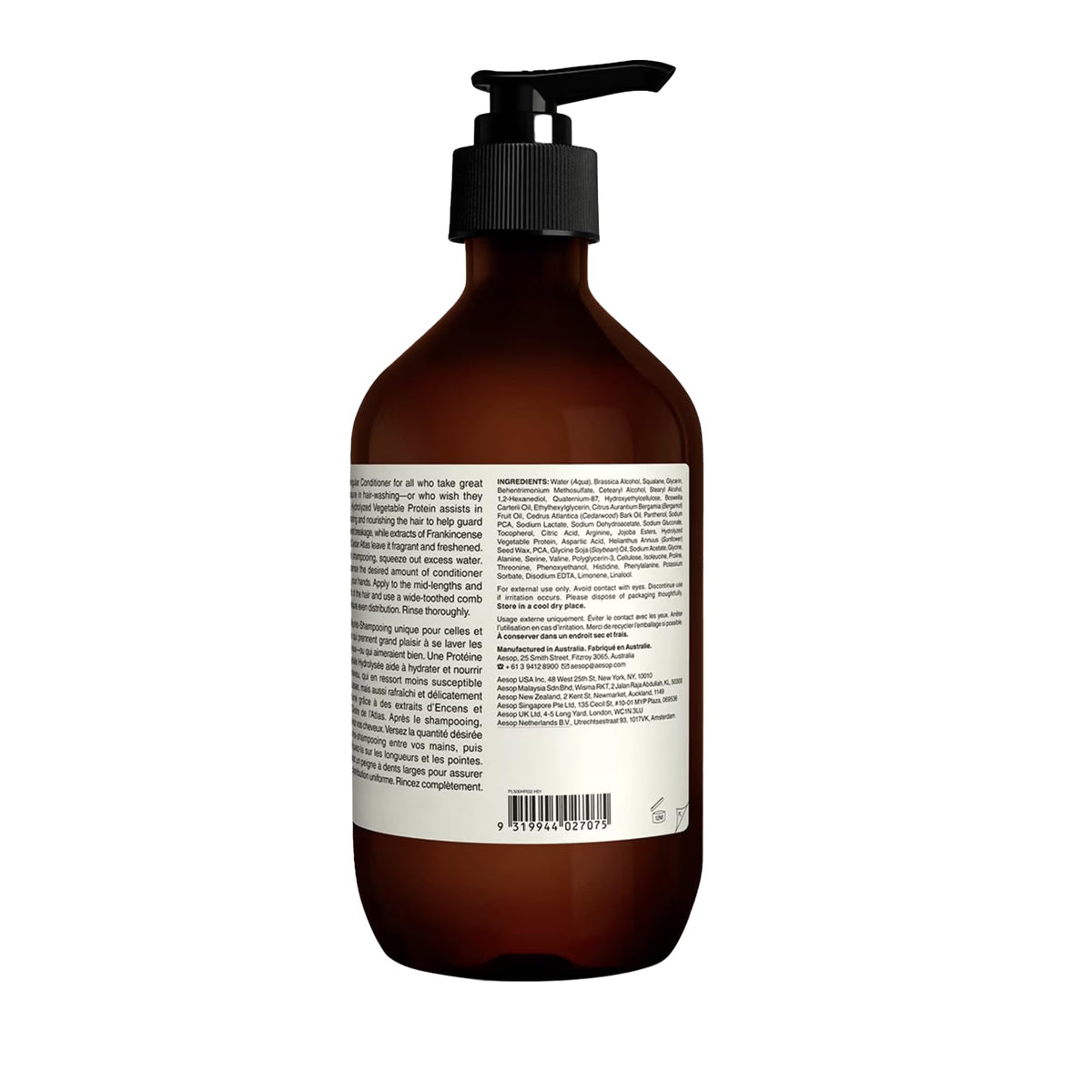 Aesop conditioner next to hand showing 500mL size and travel-friendly volume