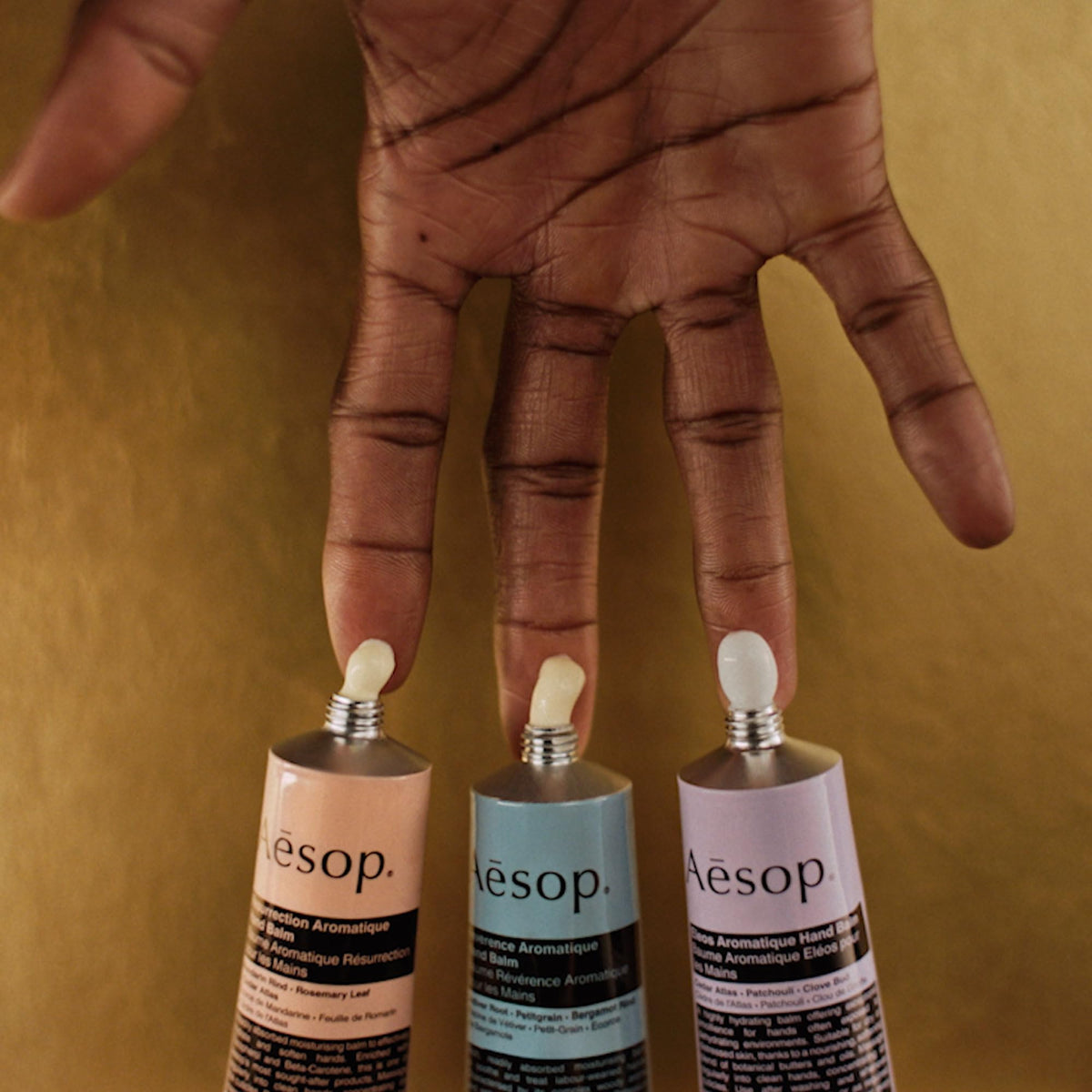 Aesop Eleos cream spread on hand demonstrating nourishing, soothing effect