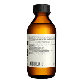 Aesop bottle beside botanicals showing natural ingredients