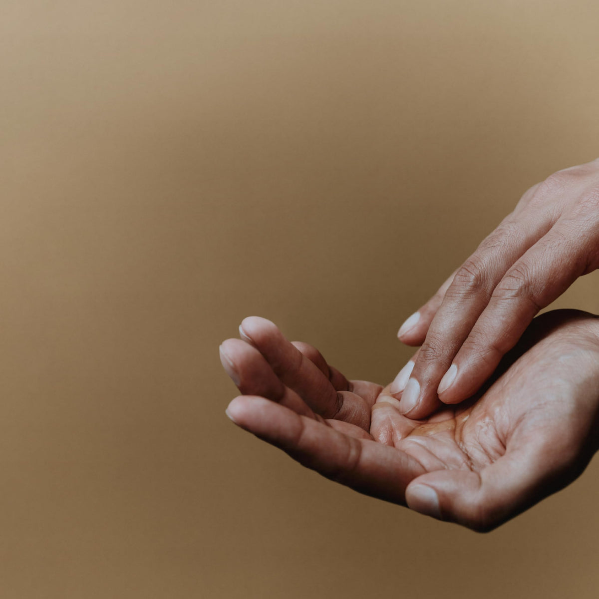 Aesop cleanser poured on palm showing smooth rinsing benefit