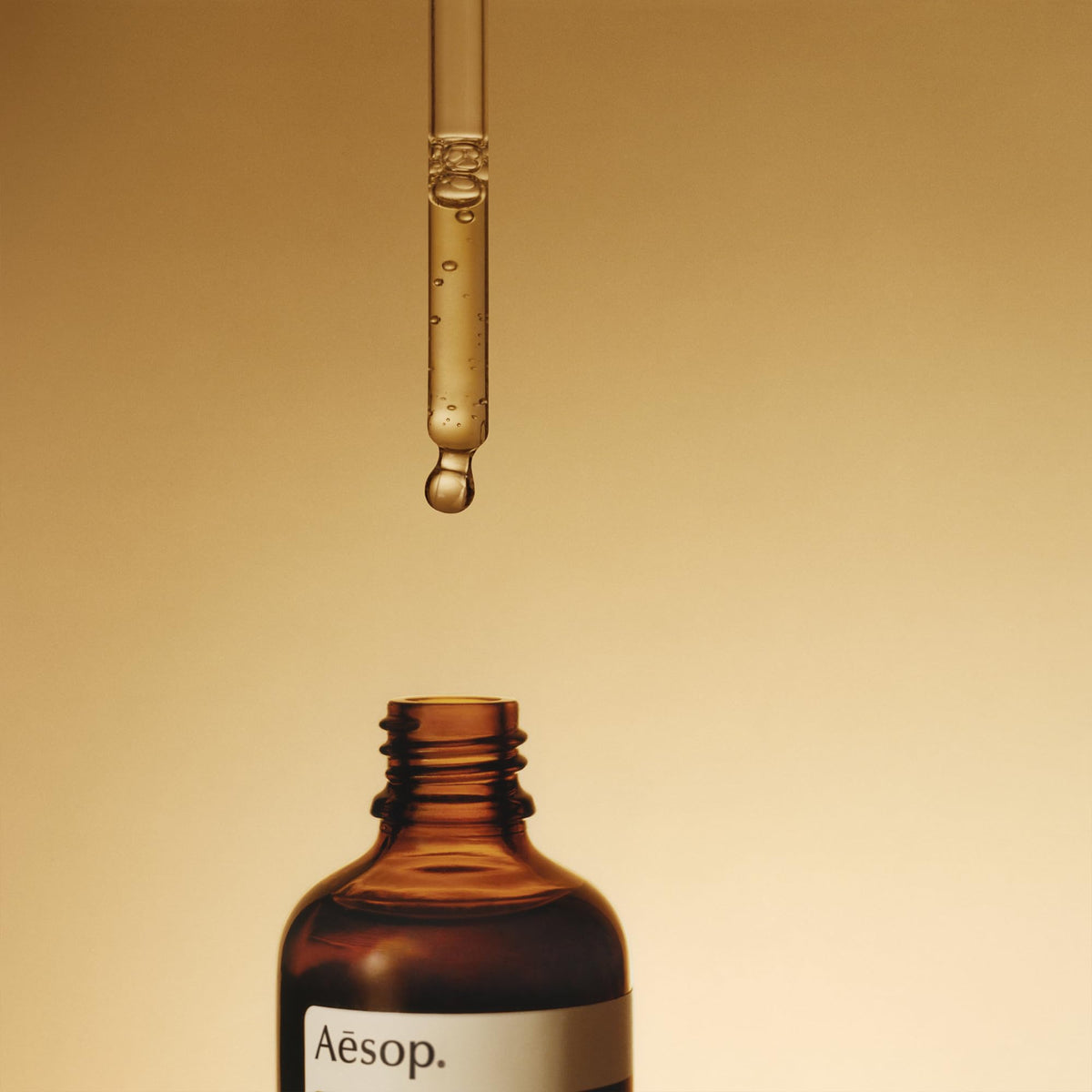Aesop Fabulous Face Oil blended with cream on fingertip for customizable hydration