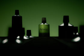 Aesop jar on bathroom shelf, lifestyle scene suggests daily ritual use