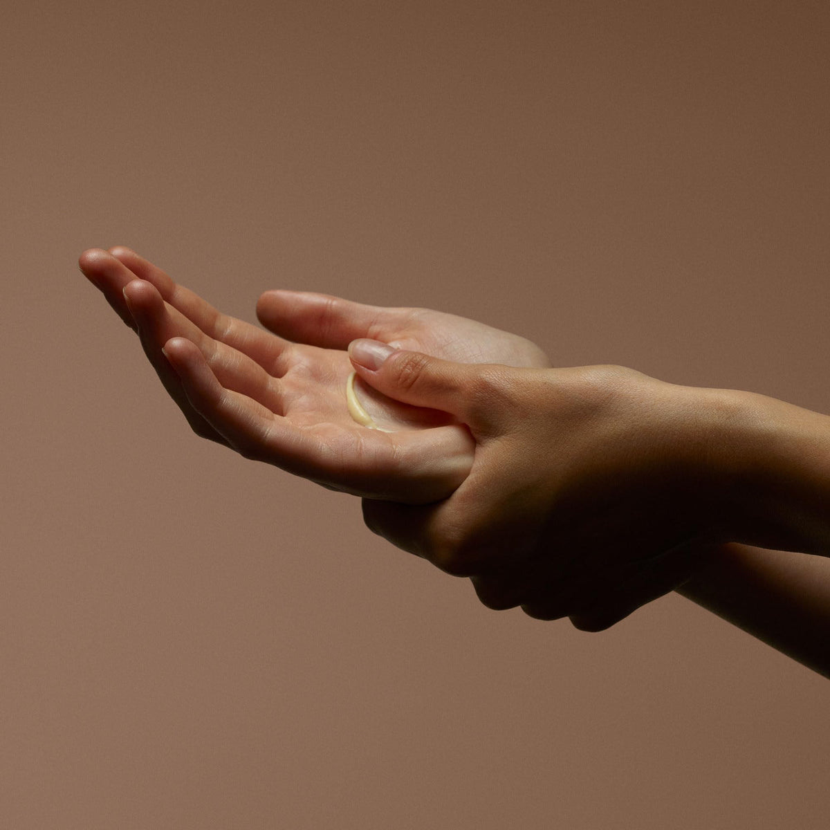 Aesop hand application in use showing balm massage for conditioned cuticles benefit