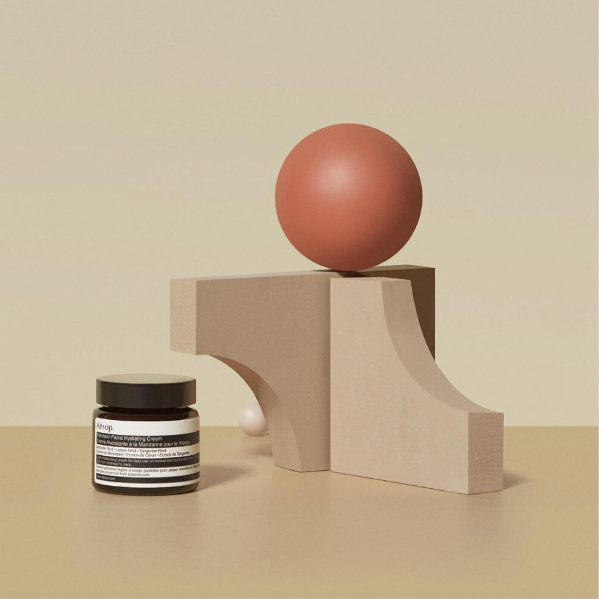 Aesop cream spread on hand, illustrates light hydration and non-greasy finish