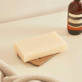 Aesop low-foam lather on skin demonstrating gentle cleansing benefit