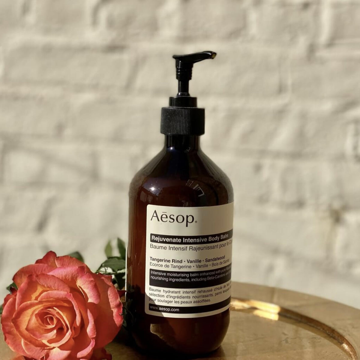 Macadamia nuts and oil beside product, highlights Aesop nourishing ingredient benefit