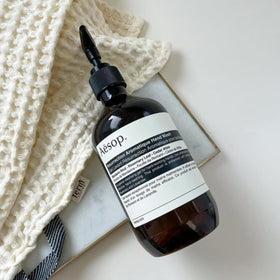 Aesop label noting recycled-plastic bottle to emphasize sustainability effort