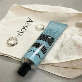 Aesop hand application showing quick absorption and softening benefit