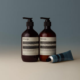 Aesop balm applied to hands showing absorption and finish benefit: non-greasy softness
