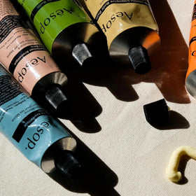 Aesop recycled aluminum tube label emphasizing sustainable packaging benefit