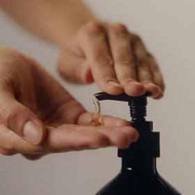Aesop cleanser dispensed on hand demonstrating easy spreadability
