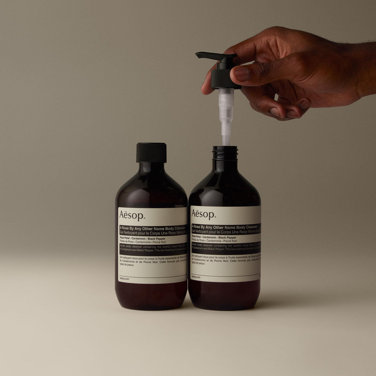 Aesop bottle in shower setting evoking aromatherapy and warm scent
