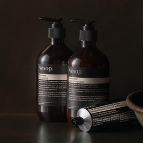 Aesop shampoo refill placed on bathroom shelf suggesting stylish sustainable routine