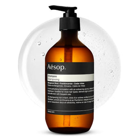 Aesop bottle front view showing minimalist label and recycled packaging benefit
