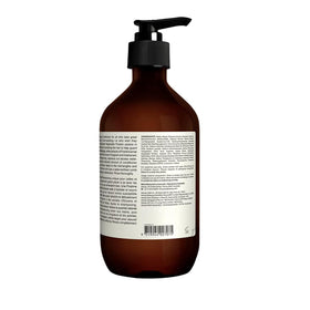 Aesop bottles in a hand to show scale and generous 16.9/17.5 oz sizes