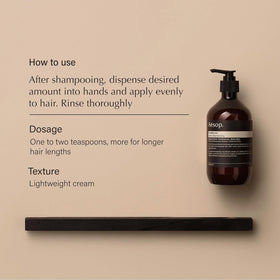 Aesop shampoo foam on hand demonstrating lather and gentle cleansing