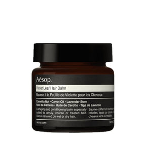 Aesop violet leaf hair balm front packaging showing compact 60 mL jar and label benefit