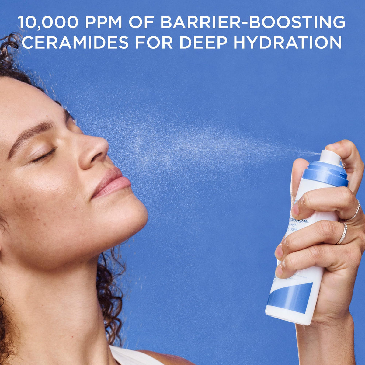 AESTURA bottle in hand for size and portability, convenient on-the-go moisturizing